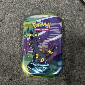 Pokemon Trading Card Game Tin with Umbreon in Black, Yellow, and Purple